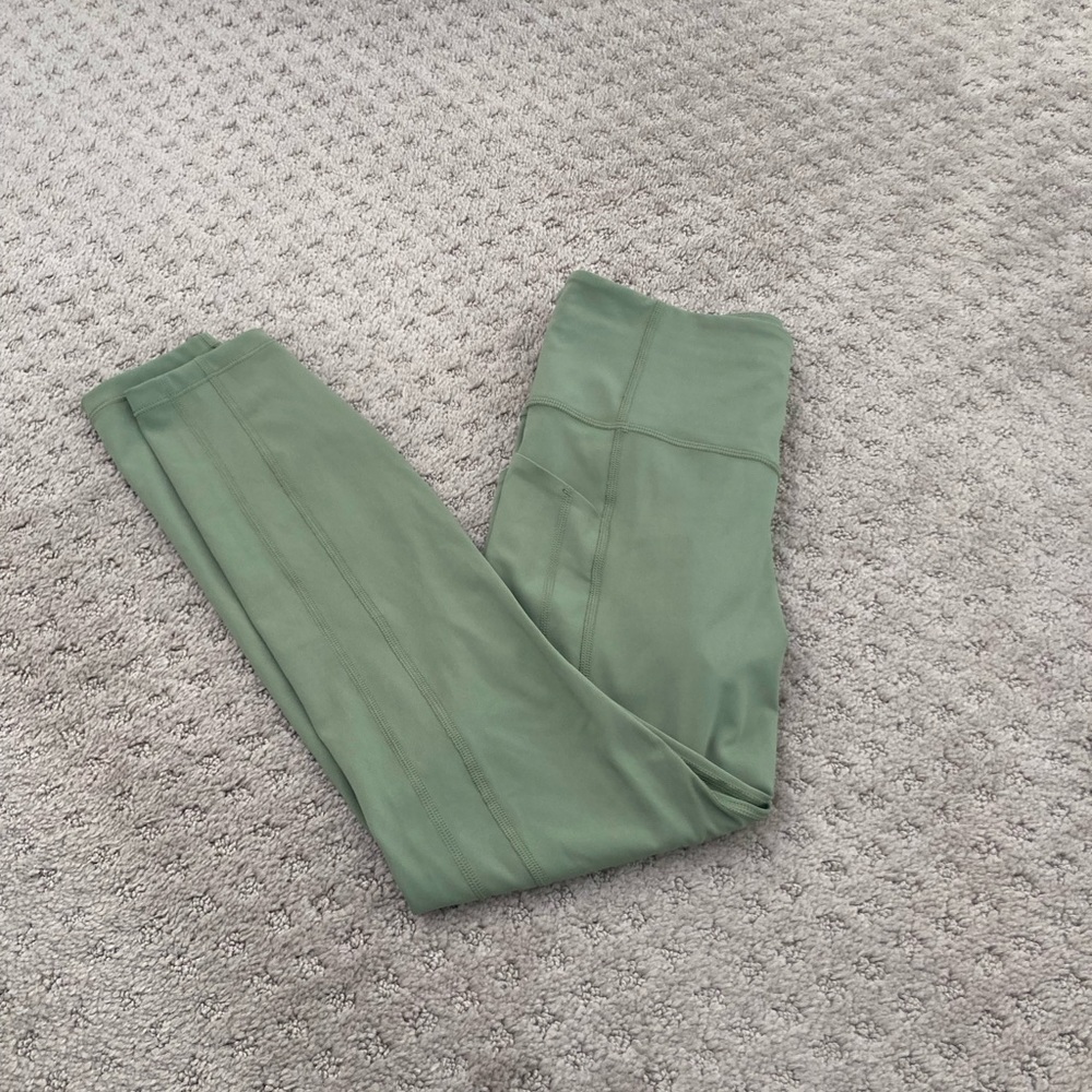 Athleta ultimate stash 7/8 tight green